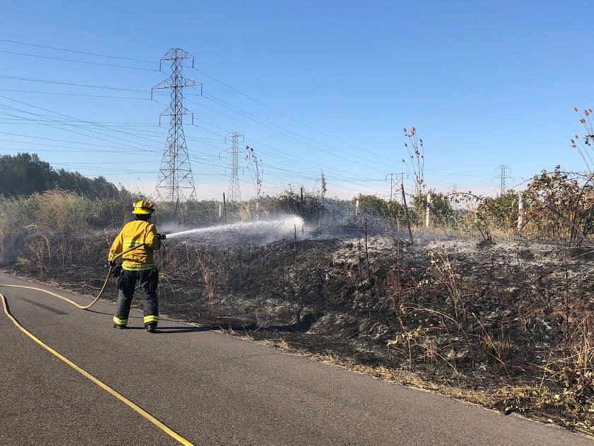 Helicopter drops water as blaze burns through 166 acres in west Vancouver | Local News