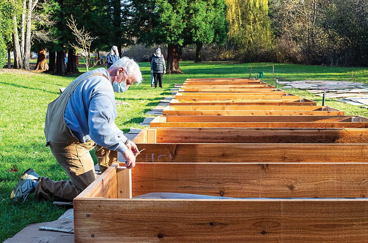 Volunteers working to build neighborhood community garden